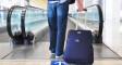 Traveler with a bag at the speedwalk